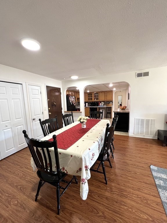4 Shadowbrook Lane, Unit 6 Milford, MA 01757 - Photo 8 of 16 a view of a dining room with furniture and wooden floor