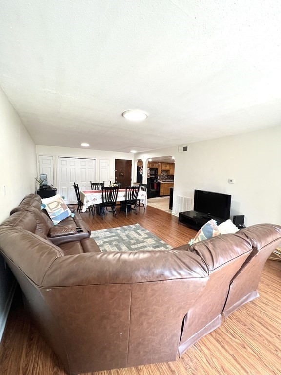 4 Shadowbrook Lane, Unit 6 Milford, MA 01757 - Photo 10 of 16 a bed room with a bed and a chair