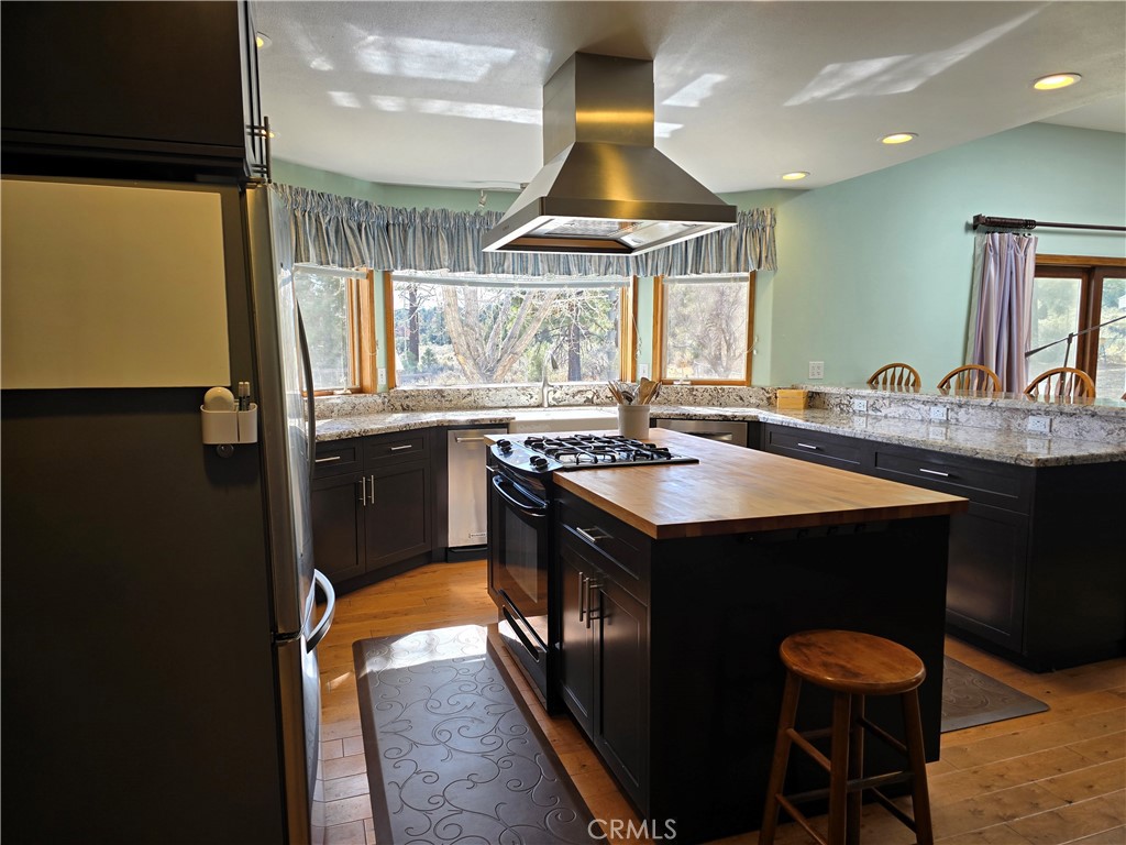 1014 Dusty Road Frazier Park, CA 93225 - Photo 17 of 40 a kitchen with stainless steel appliances granite countertop a sink a stove and a refrigerator