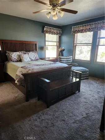 a bathroom with a sink a light fixture and a toilet