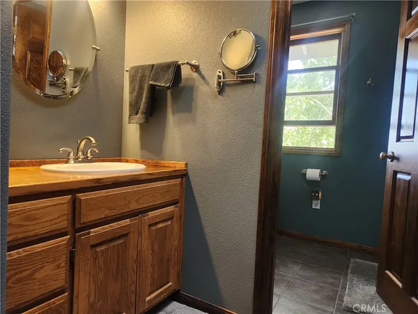 a room with a large window and chair