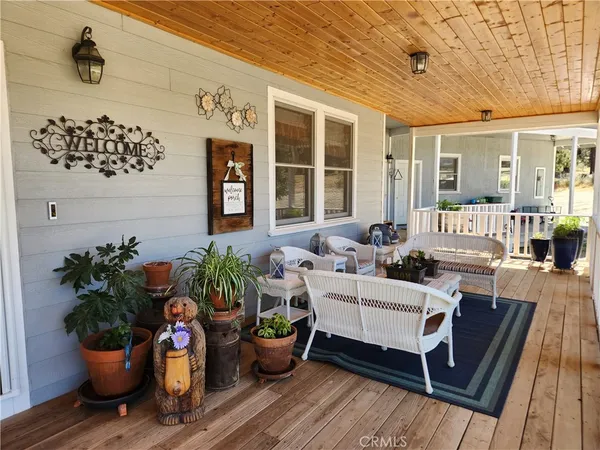 a building outdoor space with furniture potted plant and wooden floor