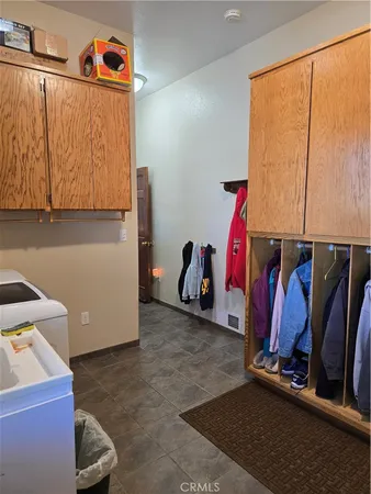 a view of walk in closet with clothes