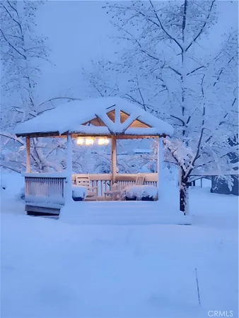 a view of a chairs and table in the patio
