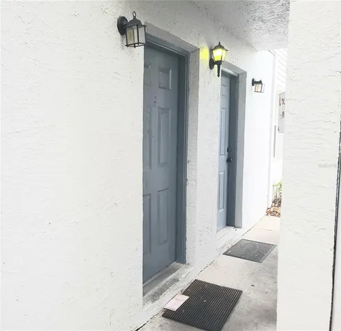 a view of a bathroom from a hallway