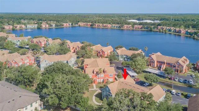 a view of a street with a bench and trees around