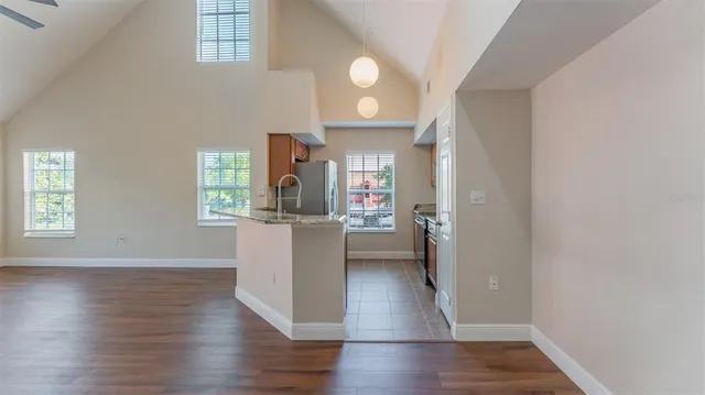 a kitchen with granite countertop a stove oven and a refrigerator