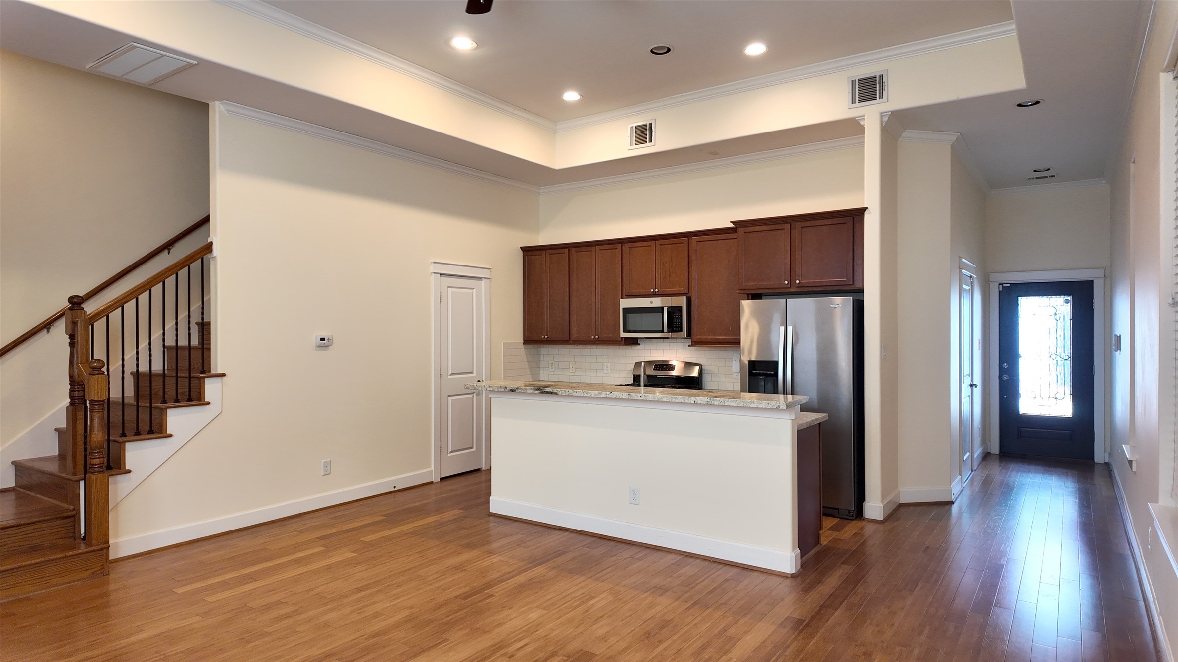 902 West 20th Street, Unit B Houston, TX 77008 - Photo 4 of 15 a kitchen with stainless steel appliances a refrigerator and a stove top oven