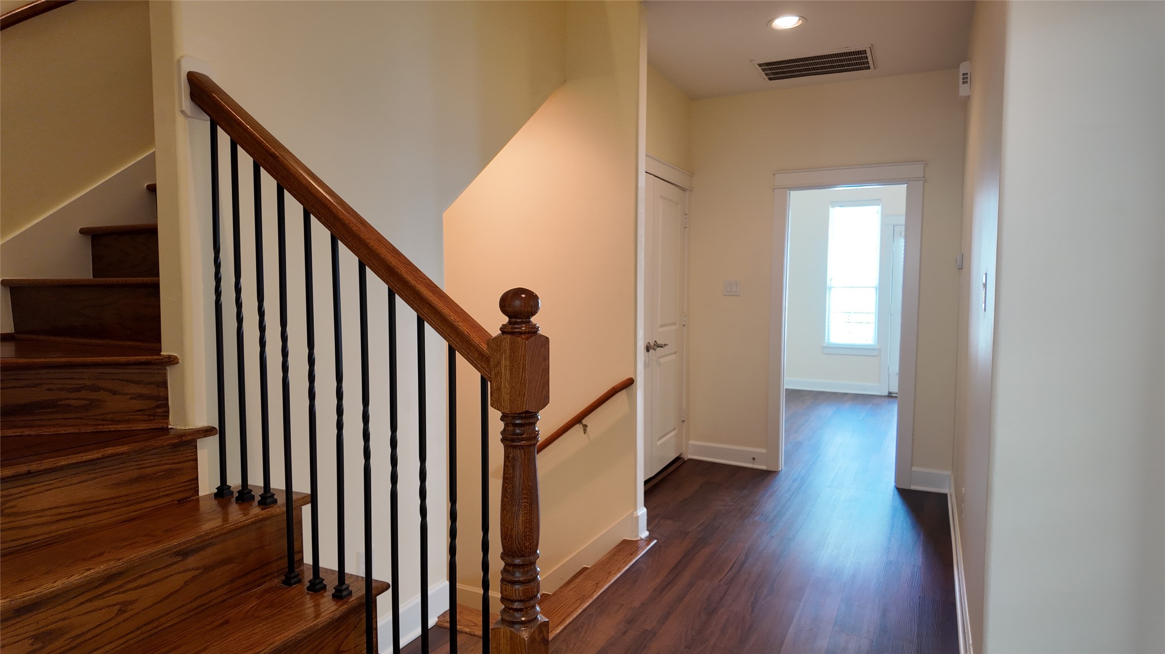 902 West 20th Street, Unit B Houston, TX 77008 - Photo 6 of 15 a view of a hallway with wooden floor and staircase
