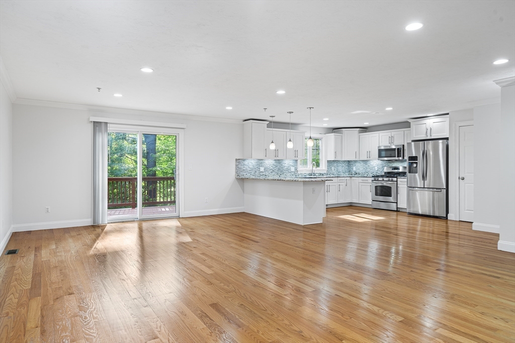 215 Rangeway Road, Unit 31 Billerica, MA 01862 - Photo 12 of 40 a view of kitchen with wooden floor and windows