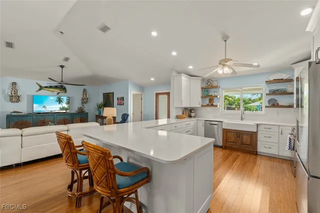 a large kitchen with a table and chairs in it