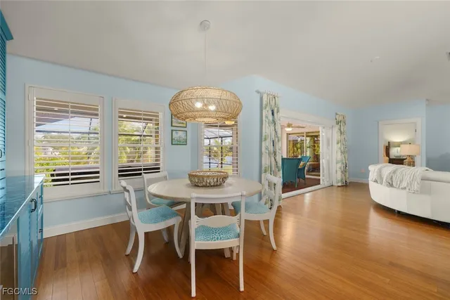a view of a livingroom with furniture window and wooden floor