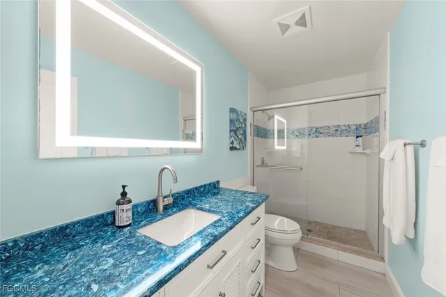 a kitchen with a refrigerator and window