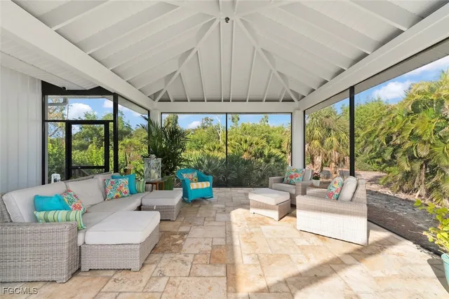 a building outdoor space with patio furniture and potted plants