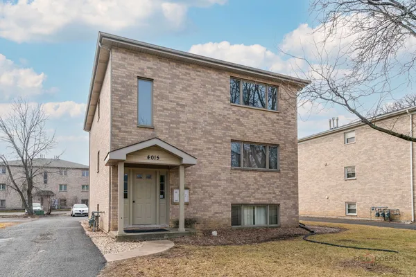 a front view of a house with yard