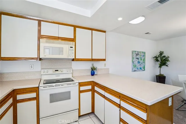 a kitchen with a stove a sink and a refrigerator