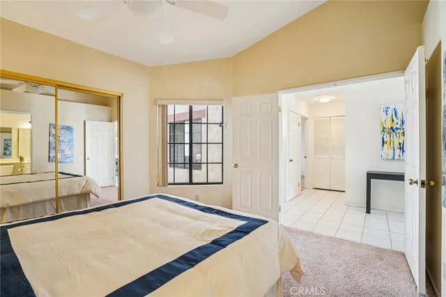 a spacious bedroom with a bed and a table