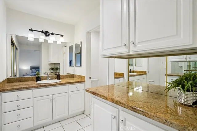 a kitchen with sink and cabinets