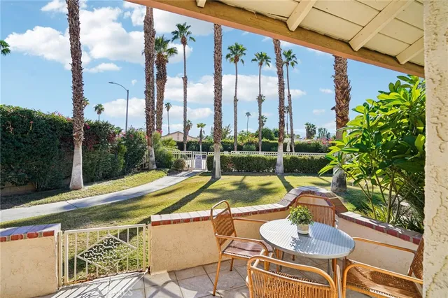 a view of swimming pool with outdoor seating