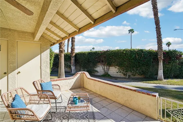 a view of swimming pool with seating area and furniture