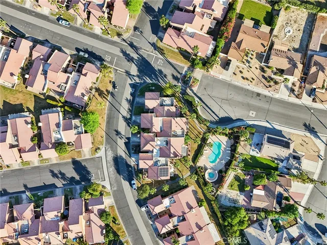an aerial view of residential houses with outdoor space
