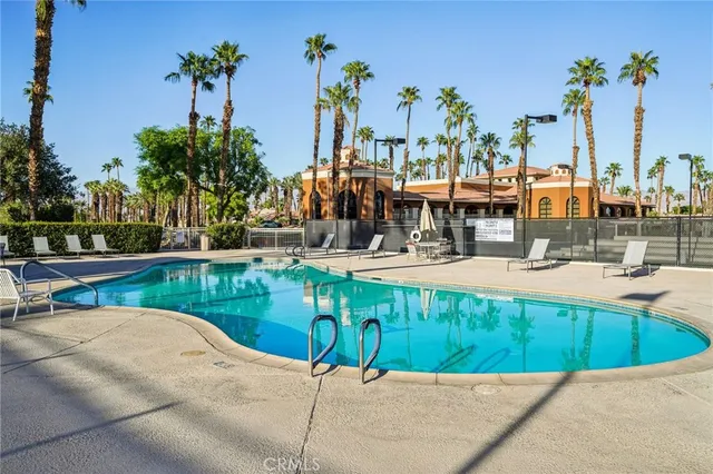 a view of a swimming pool with a patio