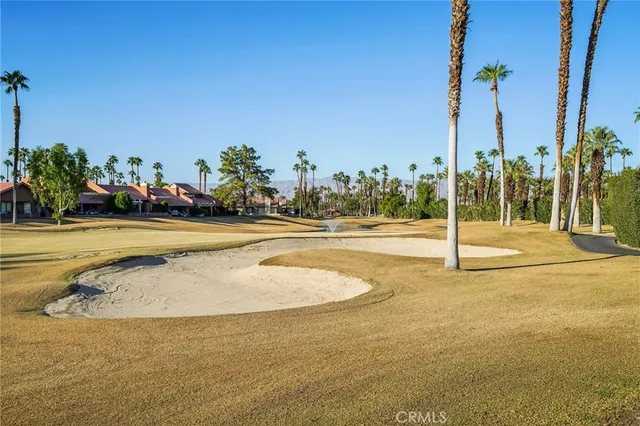 a view of outdoor space with swimming pool and furniture