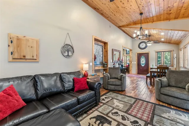 a living room with furniture and a clock