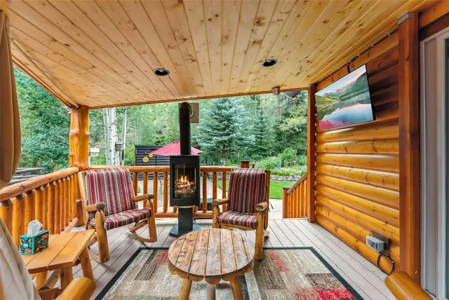 a view of a chairs and table in the balcony