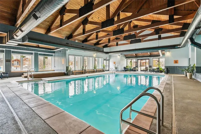 a view of a swimming pool with a patio