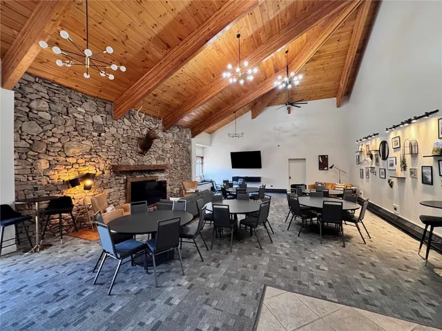 a view of a room with furniture and window