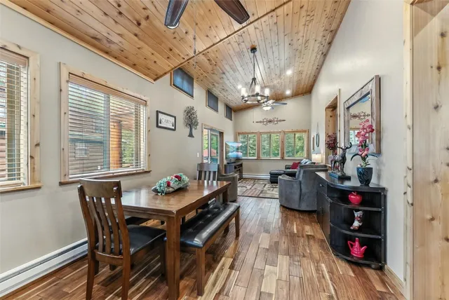 a outdoor dining space with furniture and wooden floor