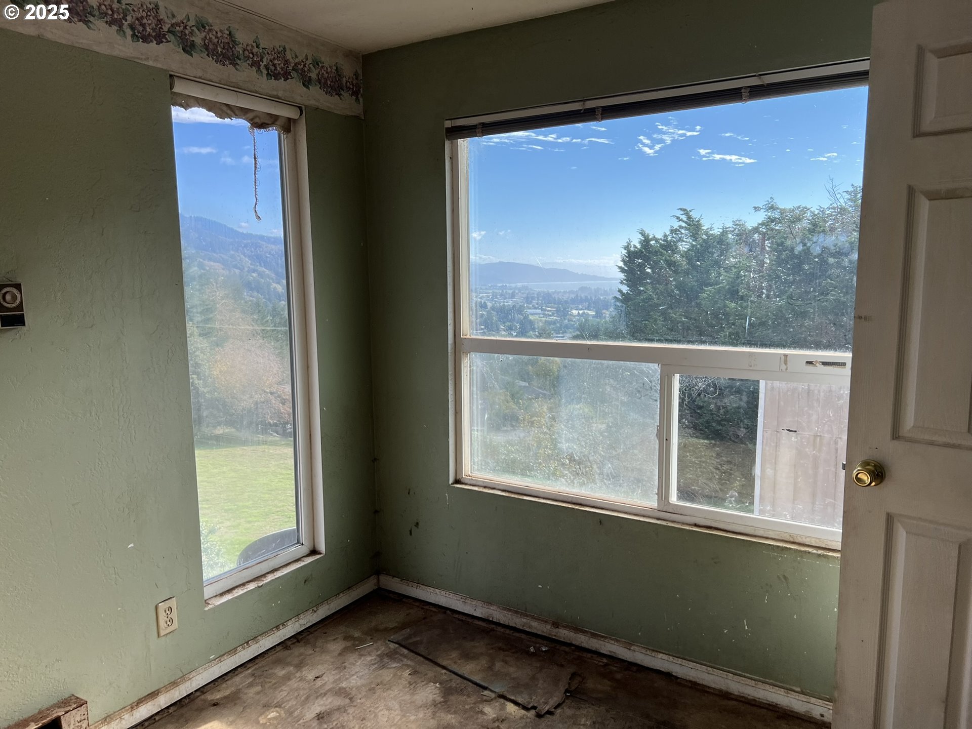 1032 Marina Heights Road Brookings, OR 97415 - Photo 15 of 43 a view of a room that has a large window
