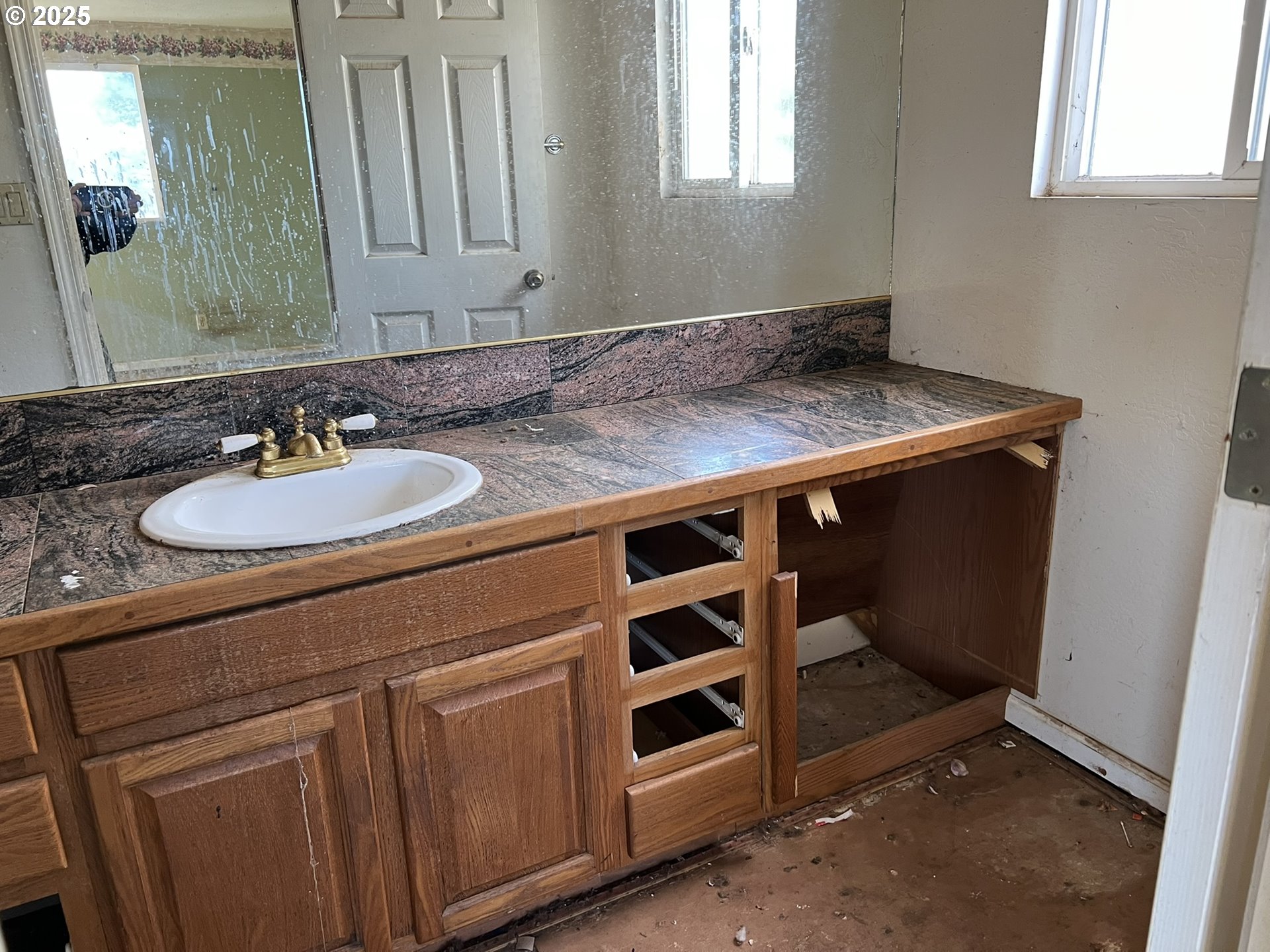 1032 Marina Heights Road Brookings, OR 97415 - Photo 19 of 43 a bathroom with a sink and a mirror