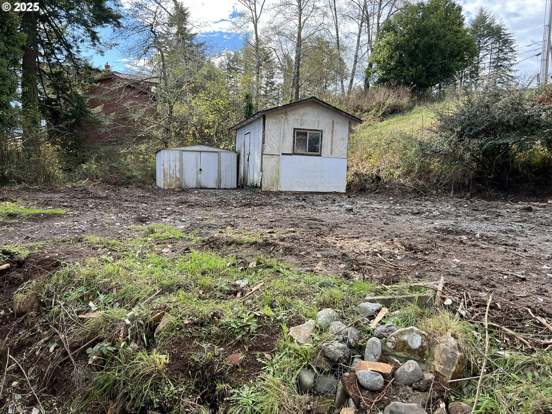 1032 Marina Heights Road Brookings, OR 97415 - Photo 3 of 43 a view of a house with a yard and large trees
