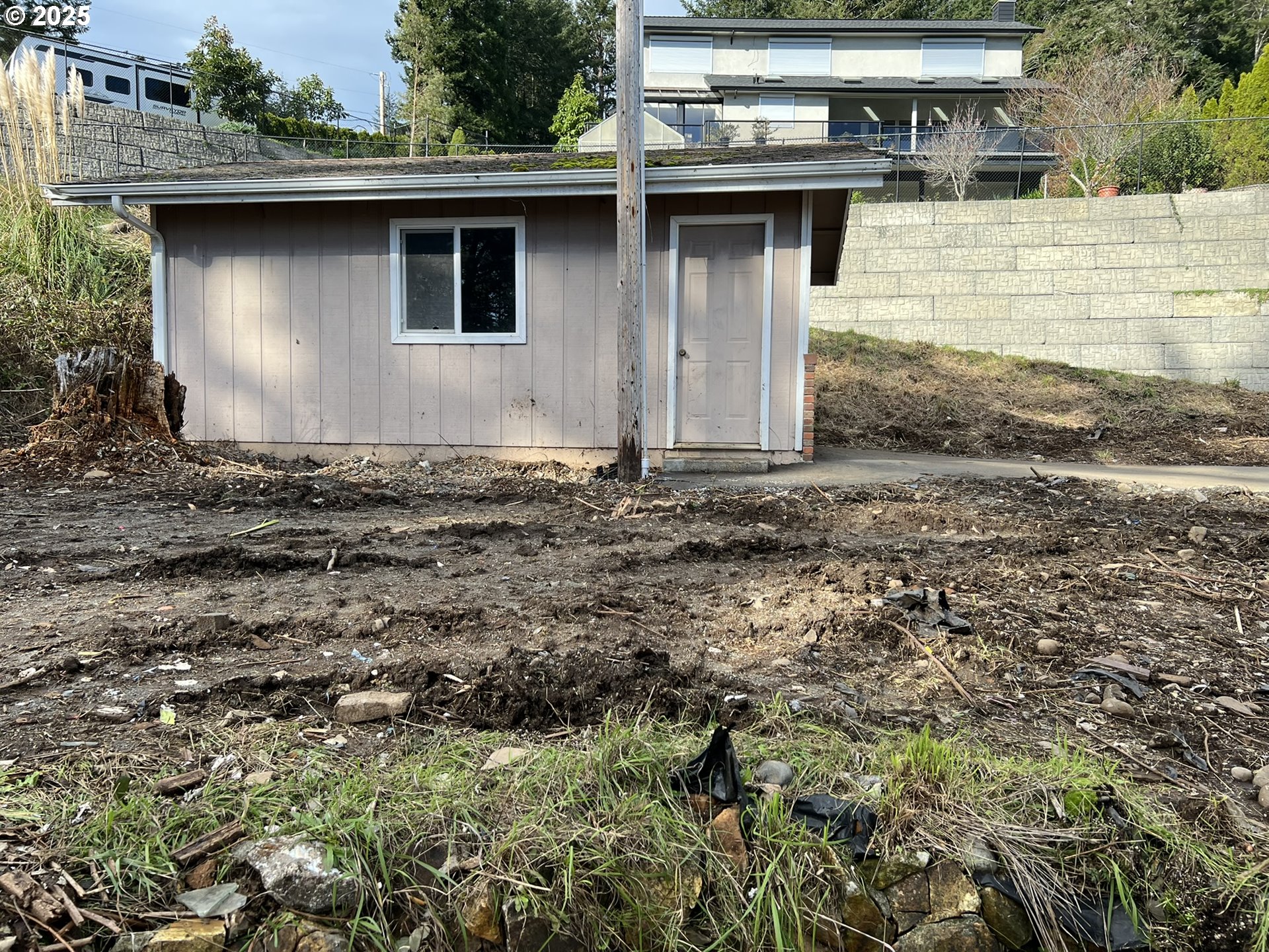 1032 Marina Heights Road Brookings, OR 97415 - Photo 4 of 43 a front view of a house with a yard