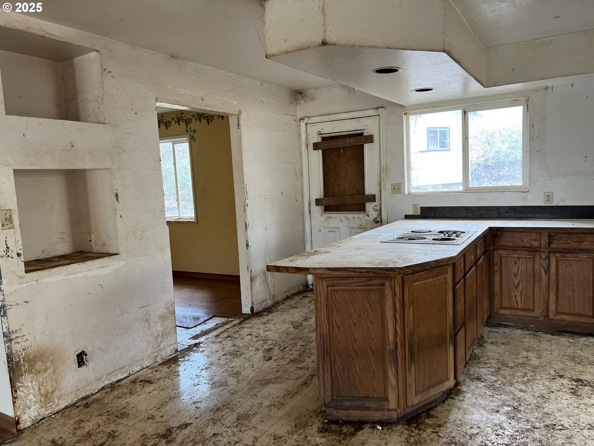 1032 Marina Heights Road Brookings, OR 97415 - Photo 7 of 43 a room with kitchen island granite countertop furniture a sink a window and stainless steel appliances
