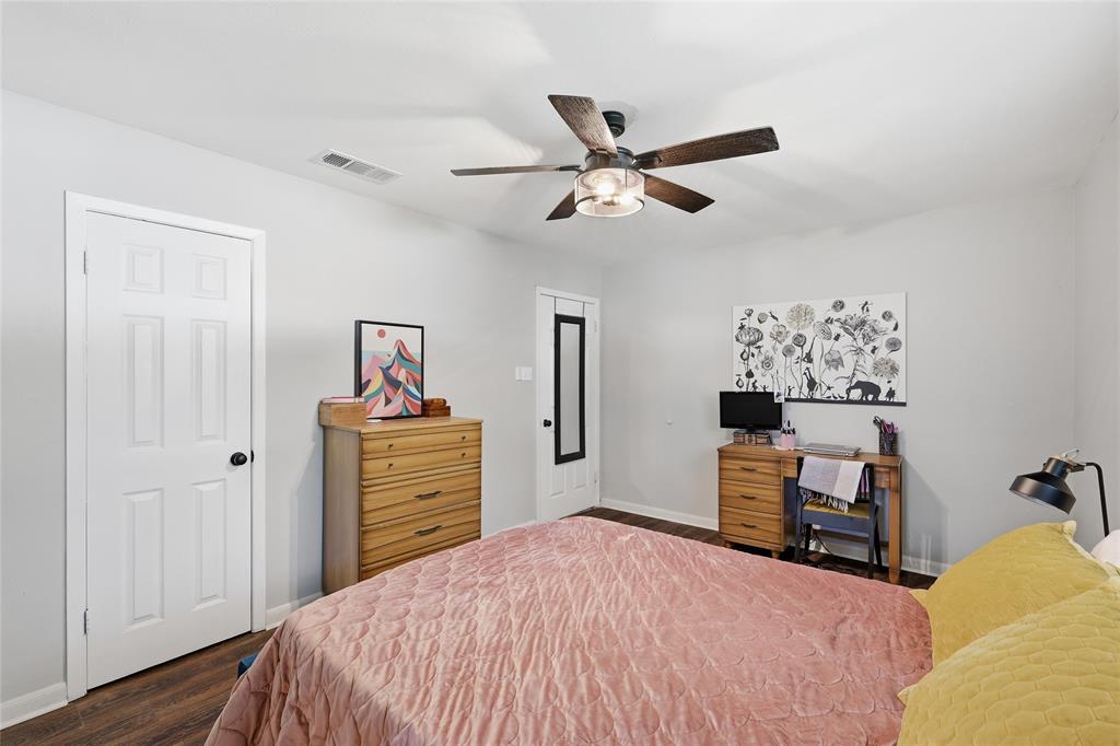 16 Coffee Tavern Road Bedford, TX 76022 - Photo 13 of 24 Interior space featuring wood-finish flooring, light gray walls, and a ceiling fan with integrated lighting