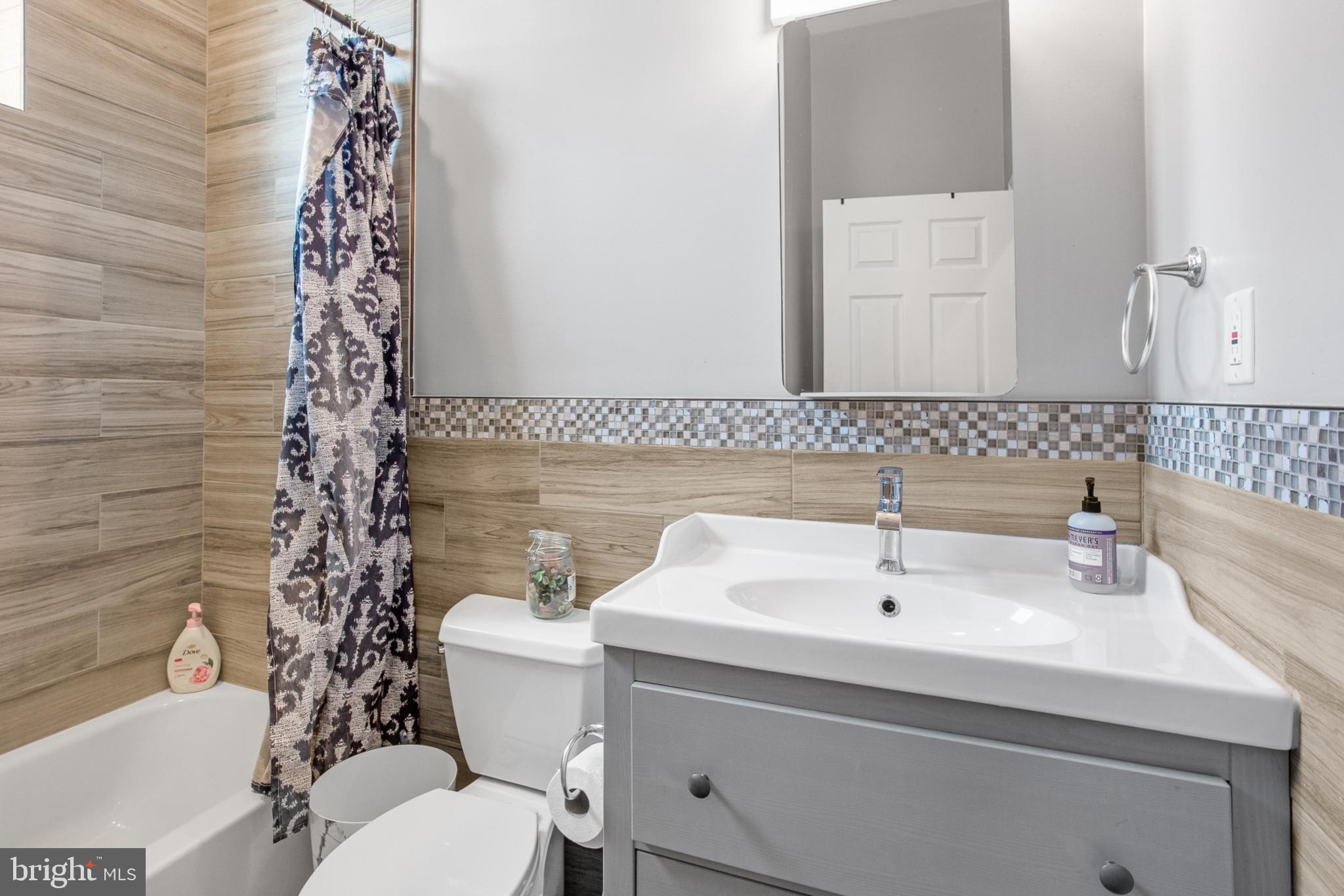 511 South Street, Unit 2 Philadelphia, PA 19147 - Photo 13 of 24 a bathroom with a sink toilet and shower