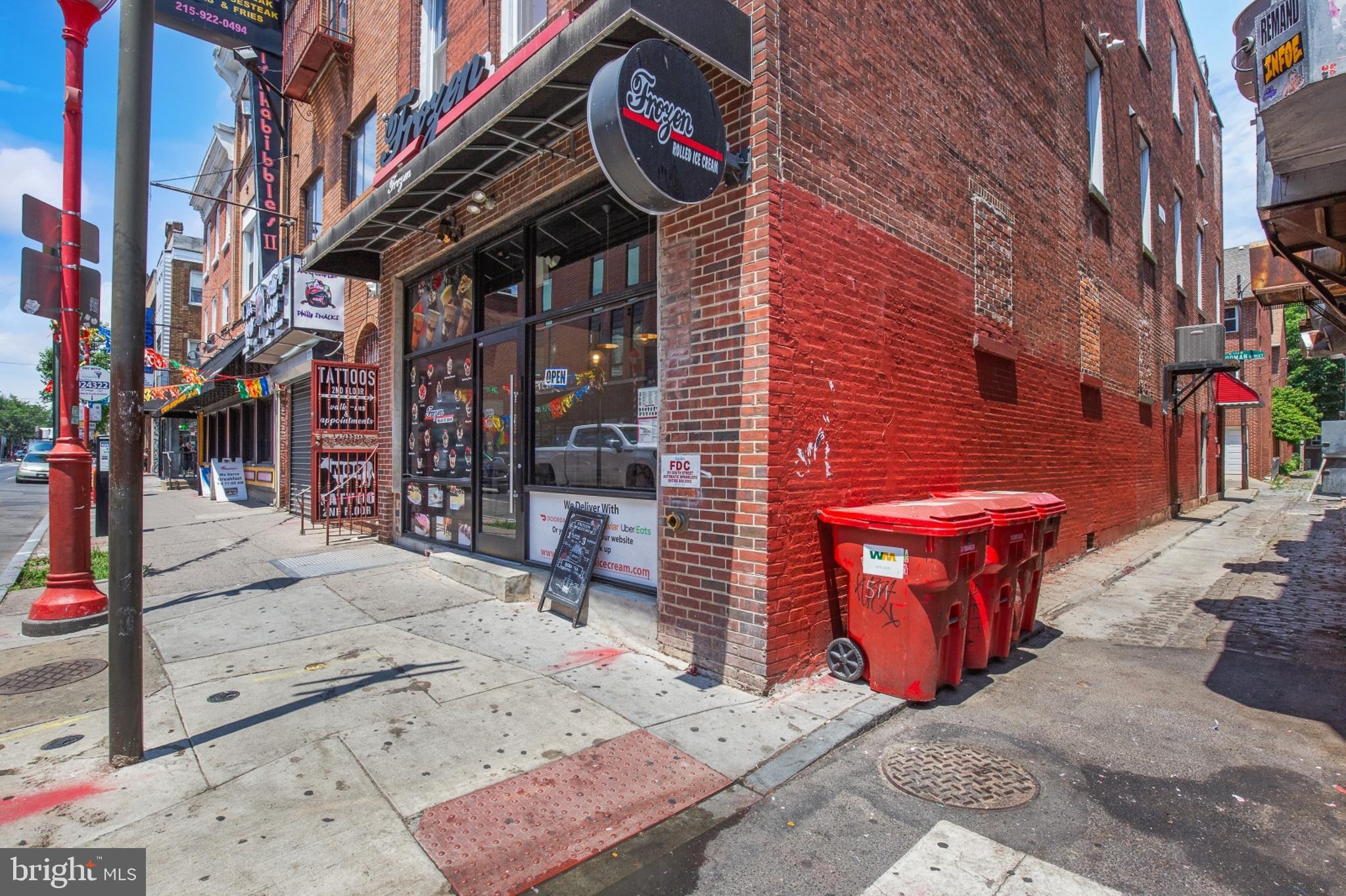 511 South Street, Unit 2 Philadelphia, PA 19147 - Photo 23 of 24 a view of a brick building with a bench in front of building