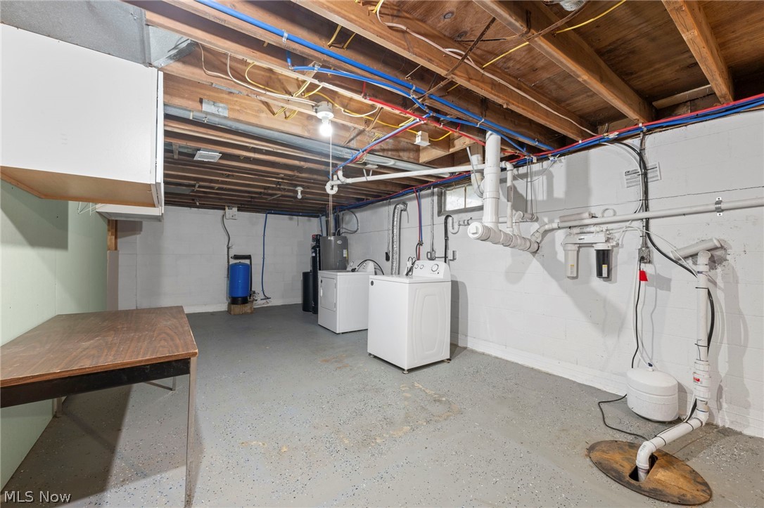 1835 Windham Road Newton Falls, OH 44444 - Photo 21 of 40 Basement featuring drainage system, washing machine and dryer, and a water pressure tank