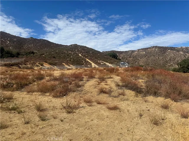 a view of mountain with sunset