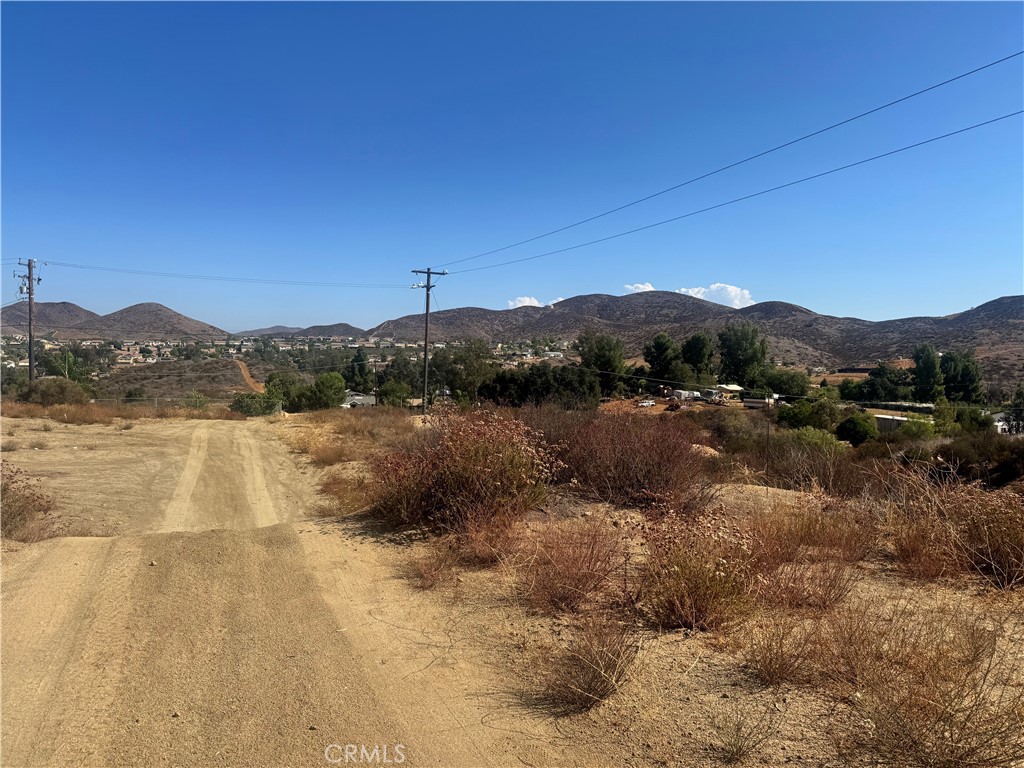 19081 Magnolia Menifee, CA 92584 - Photo 5 of 7 a view of a lake with mountains in the background