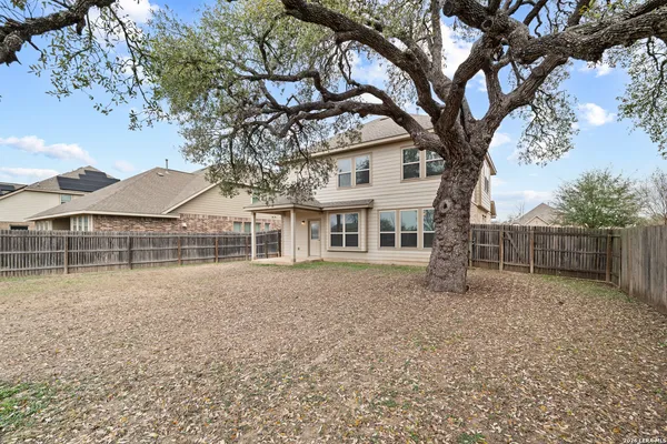 a view of house with a yard