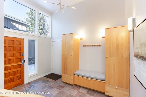 a view of front door with wooden floor