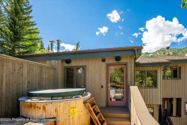 a view of a balcony with table and chairs