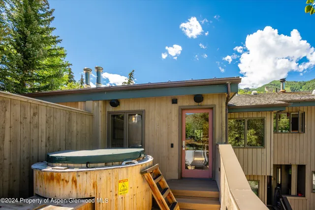 a view of a balcony with table and chairs
