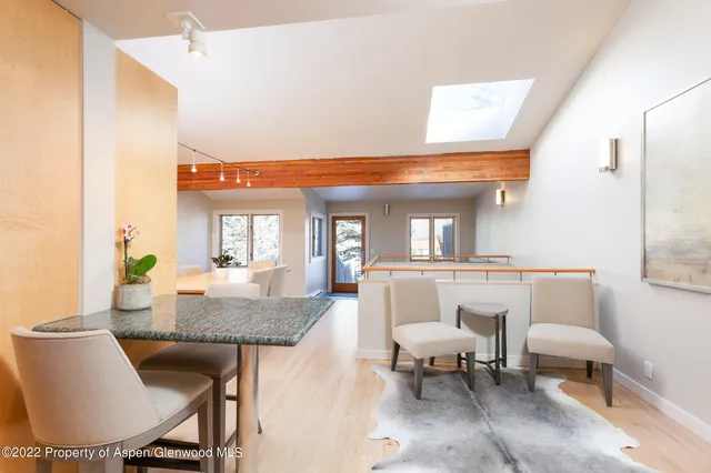 a dining room with furniture and window