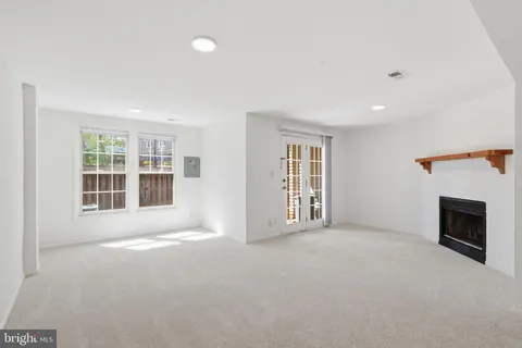 an empty room with a fireplace