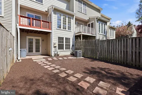 a view of a brick house with many windows